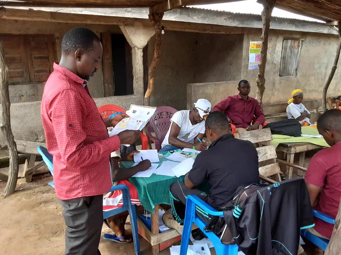 Source: CEPI - Group of people sat at table outside completing paperwork