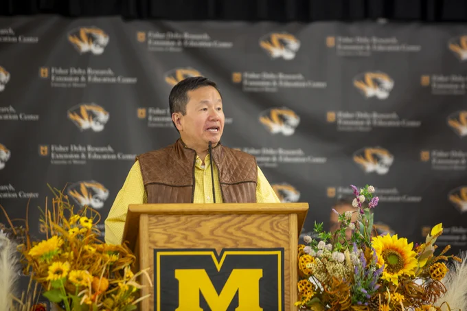 President Choi at a podium. 