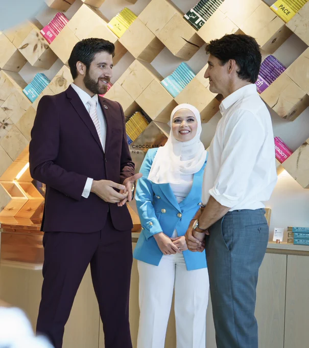Prime Minister Justin Trudeau meets with Tareq Hadhad and his wife Mila while visiting their store, Peace by Chocolate, on the Halifax Waterfront in Halifax, Nova Scotia. 