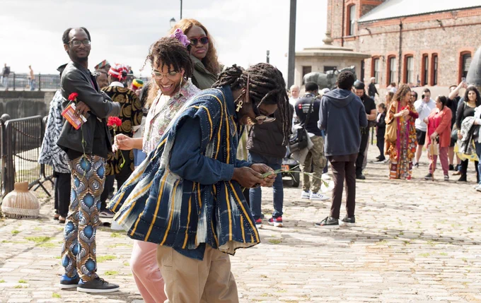 People dancing on quayside