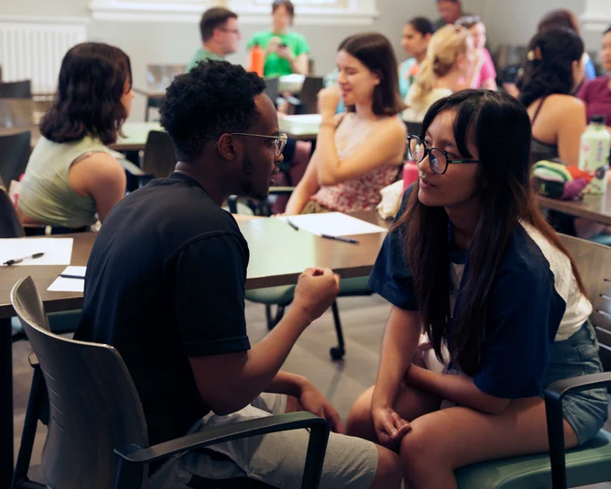 Two students engaged in discussion