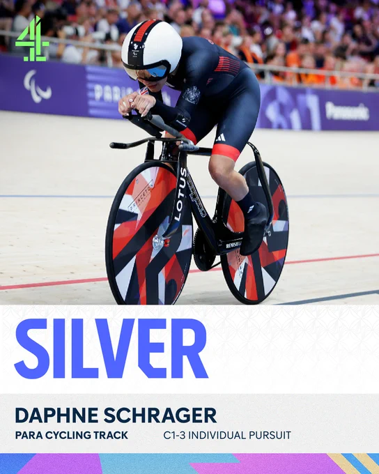 ParalympicsGB's silver medal cyclist, Daphne Schrager, on her bike, lycra-clad, crossing the finish line in the velodrome.