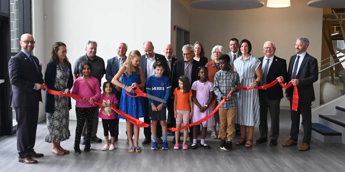 Group photo at Ribbon cutting for grand opening of St. Genevieve Catholic School.