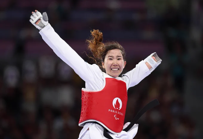 Zakia Khudadadi of Refugee Paralympic Team celebrates after winning the Women's Taekwondo K44 -47kg Repechage contest against Nurcihan Ekinci of Team Turkey (not pictured) on day one of the Paris 2024 Summer Paralympic Games at Grand Palais on August 29, 2024 in Paris, France.