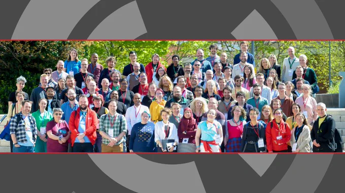 Group picture at CW24, the SSI Icon on a dark background
