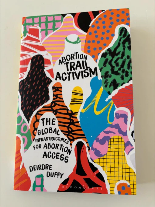 The front cover of the book has multiple faceless women in bright patterns and colours. The title reads: Abortion Trail Activism: the global infrastructure for abortion access by Deirdre Duffy.