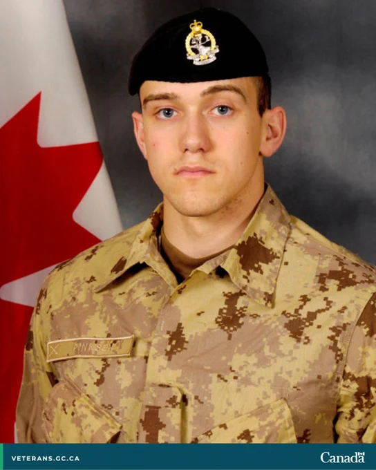 Military portrait of Corporal Brian Pinksen in uniform. 