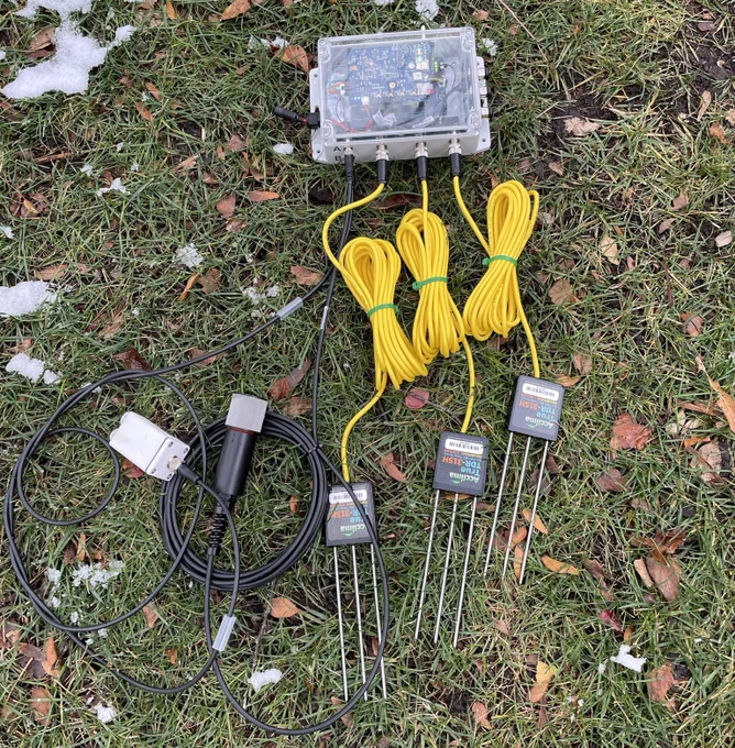 A remote sensing node laid out on a turfgrass surface. 