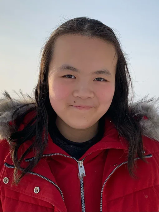 Katie Yu | Chemical Engineering wearing a red winter jacket and smiling at the camera.