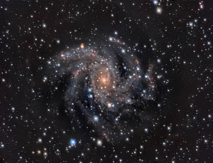 Celestron C11,  6.3Reducer, ASI533MCPRO, Optolong L-Pro, IR CUT, 7 hours total  intergration 
Post Process in SIRIL, Affinity Photo.

Colourful spiral galaxy on dark background of space.