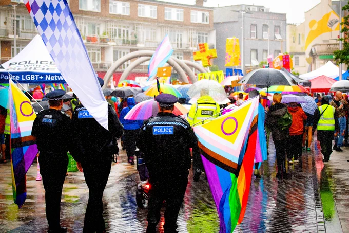 Marchers walking through the rain at Dover Pride 2024.