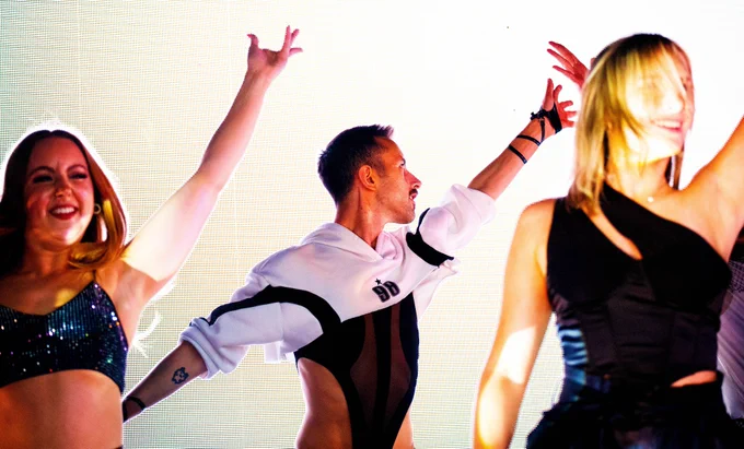 A member of the dance group Haus Of Heels strikes a pose during Dover Pride 2024.