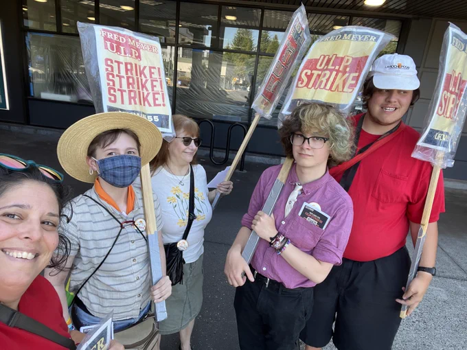 People holding picket signs