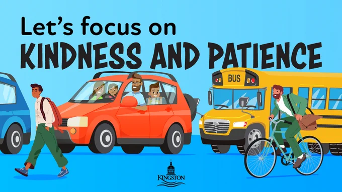 Illustration promoting "Let's focus on Kindness and Patience", showing a bustling street scene with cars, a yellow school bus, and people commuting by foot and bicycle against a blue background.