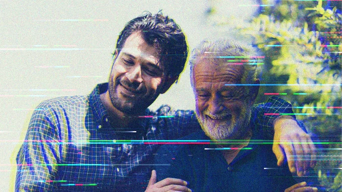 A younger man embraces an older man from the side. The image shows artifacts and static that one might see on a corrupted image file or bad video connection. Photo-Illustration by Martha Morales.