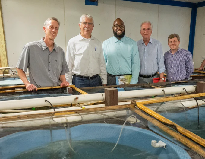 Pictured from left, Peter Allen, Robert Bertram, Tyrell Kahan, Daniel Gustafson, and Stephen Reichley at the MAFES H.H. Leveck Animal Research Center Aquaculture Facility. (Photo by Tom Thompson)