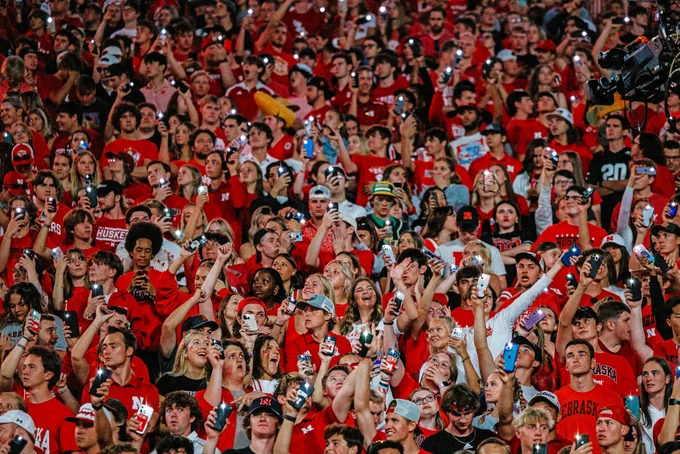 Husker fans light up the night during the light show between the 3rd and 4th quarters