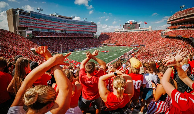Fans in the student section throw the bones