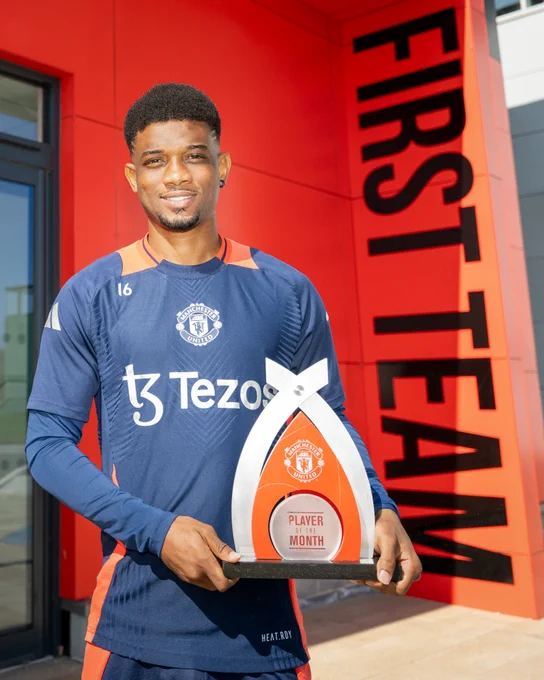 Amad poses for a photo with our Player of the Month trophy.