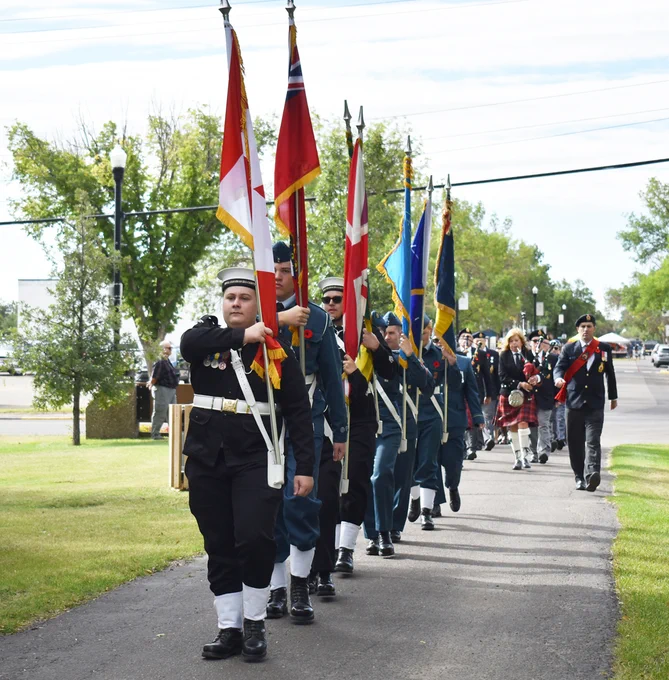 The parade group marches into Memorial Park for the commemorative ceremony, Aug. 31.
Matthew Liebenberg/Prairie Post
