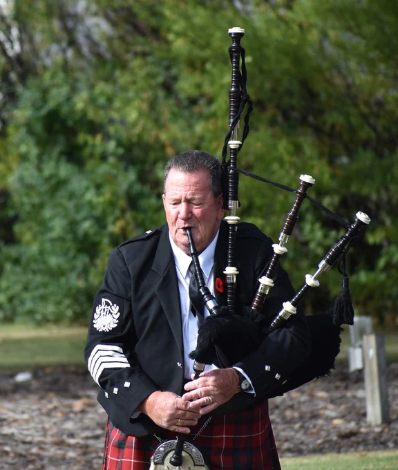Robert Heggie of the Swift Current Green Braes Pipes and Drums plays the lament during the ceremony.
Matthew Liebenberg/Prairie Post