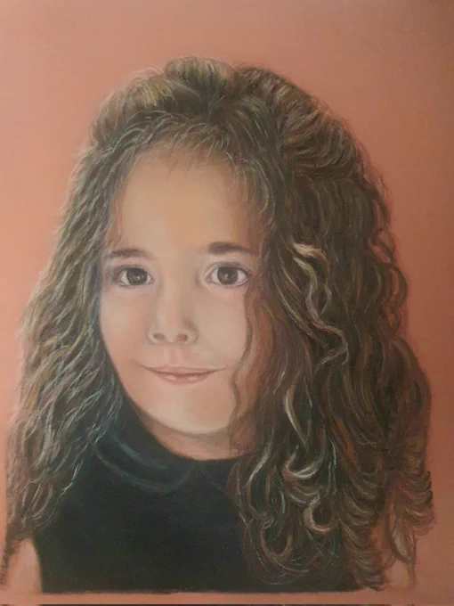 Portrait of a girl with curly hair done with pastels