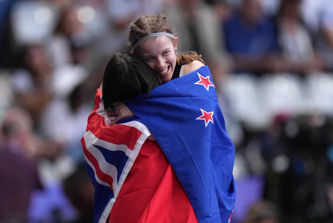 Danielle Aitchison of New Zealand hugs Yiting Shi of Team People's Republic of China after the Women's 100m Final on day seven of the Paris 2024 Summer Paralympic Games at Stade de France on September 04, 2024 in Paris, France. (Photo by Aitor Alcalde/Getty Images for IPC)