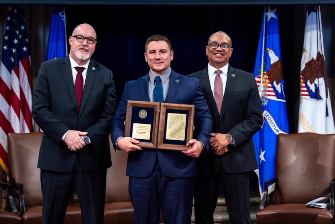 United States Marshals Service Director Ronald L. Davis (right) and Deputy Director Mark Pittella (left) present Deputy U.S. Marshal Albert Maresca, Jr. (center) with the Robert Forsyth Valor Award.