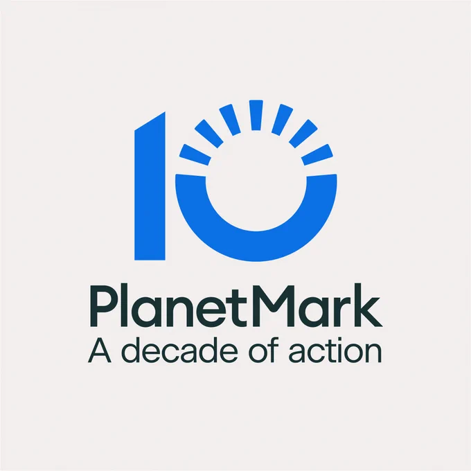 A white graphic background with 10 - Planet Mark: A decade of Action logo. The zero on the ten has broken lines in the top half of the circle in line with Planet Mark's other logos.