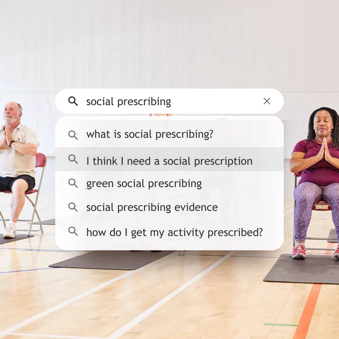 Background image of people doing chair exercise class. Web search bar, text reads 'social  prescribing'. Drop down menu with text that reads, 'what is social prescribing?', 'I think I need a social prescription', 'Green social prescribing', 'social prescribing evidence', 'how do I get my activity prescribed' 