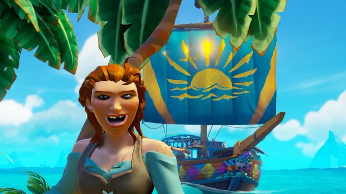 A grinning pirate missing a tooth stands in front of their ship under a bright blue sky. Said ship has a colourful hull, and a sail of bright blue which features a golden sun in its centre.