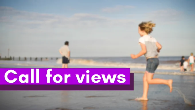 A blurry photograph of a child running on a beach. Foreground text says "call for views".