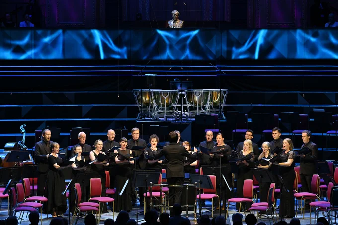 Owain Park conducts the BBC Singers on the Royal Albert Hall stage.