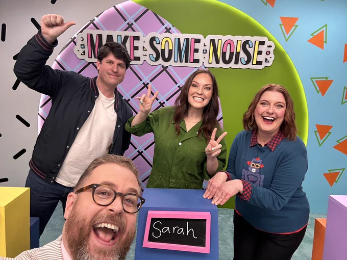 Nick, Sarah, Lauren, and Sam on the set of Make Some Noise. Sam has since started using baking soda to whiten his green tea-stained teeth. It works! 