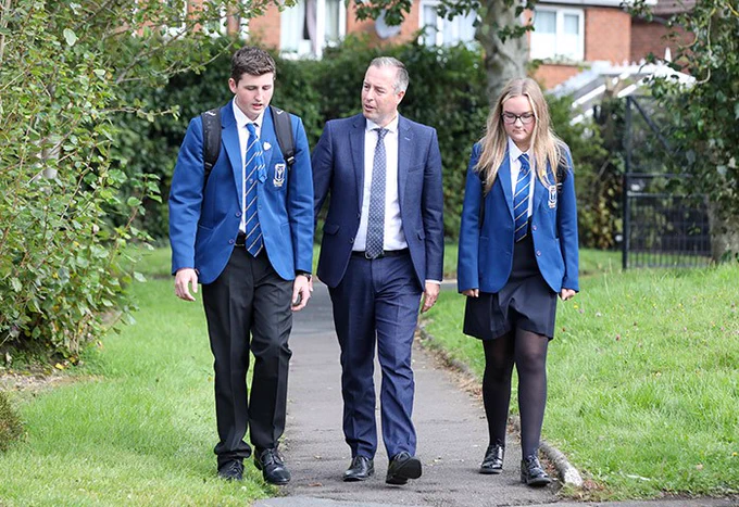 Students from St Columbanus Bangor chatting to Education Minister Paul GIvan