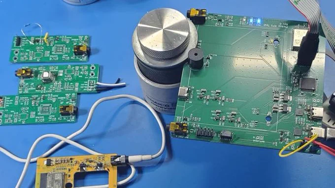Manufacturing test board to test Pickup boards, on a workbench.