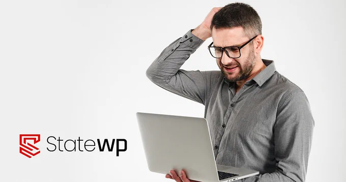 Man looking confused scratching head with right hand while holding laptop in left. StateWP logo in lower left. 