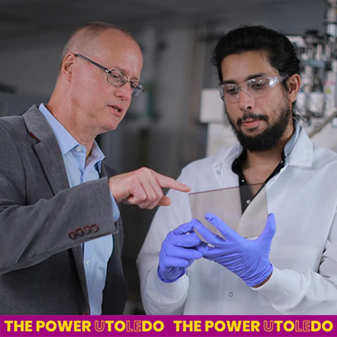 Dr. Randall Ellingson, left, a professor in the Department of Physics and Astronomy and Wright Center for Photovoltaics Innovation and Commercialization Endowed Chair, discusses materials that could be used in space-based solar technology with doctoral student Nadeesha Katakumbura.