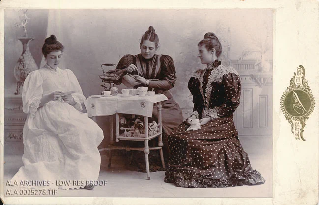 Black and white photograph of Helen Cornwell Silliman, Elizabeth Shepard Loveland, and Grace Fisher Leonard sitting.