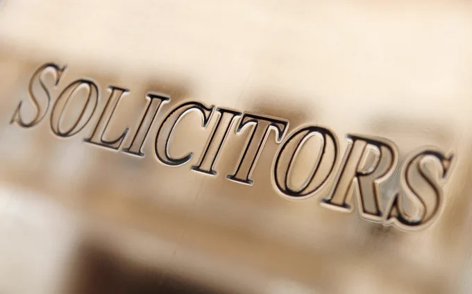 The word solicitors on a name plate
