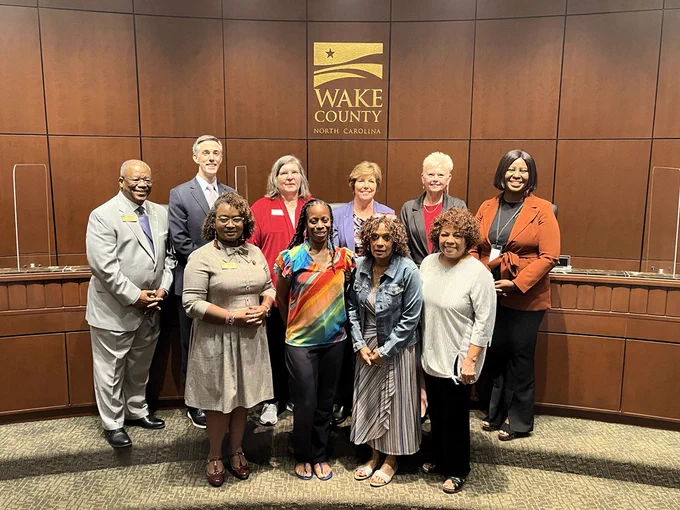 Wake County Commissioners pose for a photo with a local sickle cell advocates in the board chambers before the September 3, 2024, regular meeting. Photo includes Chair Shinica Thomas, Vice Chair Susan Evans, Commissioner Matt Calabria, Commissioner Vickie Adamson, Commissioner Don Mial, Commissioner Tara Waters and Commissioner Cheryl Stallings.