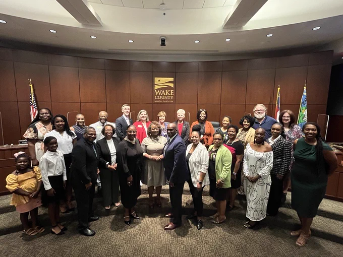 Wake County Commissioners pose for a photo with members of Sisters Inspiring Sisters Incorporated in the board chambers before the September 3, 2024, regular meeting. Photo includes Chair Shinica Thomas, Vice Chair Susan Evans, Commissioner Matt Calabria, Commissioner Vickie Adamson, Commissioner Don Mial, Commissioner Tara Waters and Commissioner Cheryl Stallings.