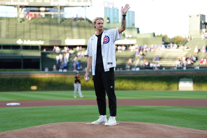 Chris Brady waves to the fans at Wrigley Field. (Photo: Matt Dirksen/Cubs)