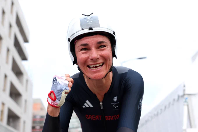 Sarah storey smiling close up making a fist at the finish line