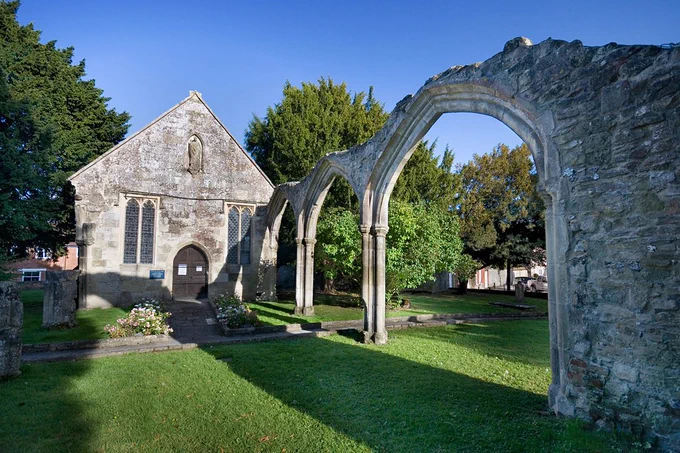 On the 11th , you can hear talks about Wiltons history and Edith of Wilton, an English saint, nun and member of the community at Wilton Abbey and her connection to pilgrimages, at St. Mary’s in Wilton, the town which once gave its name to Wiltshire. This 'old' church in the Market Place was partially demolished, upon completion of a new church in 1845, leaving only the chancel with one bay of the nave, and the ruins of the arcades and tower arch. Apart from the charming eighteenth-century ceiling, there are fascinating memorials to the people of Wilton in the remains of this church, which stands surrounded by the romantic ruins of its arcades and tower arch. (c) Fergus McNeill