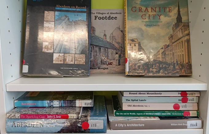 Close up of books on the "Granite City" including Footdee