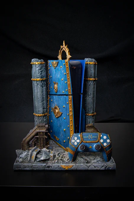 A Space Marine 2 themed custom PlayStation 5 with a custom controller.