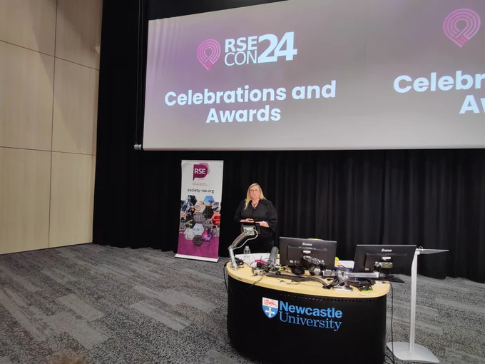 Claire Wyatt presenting the Society Community Awards