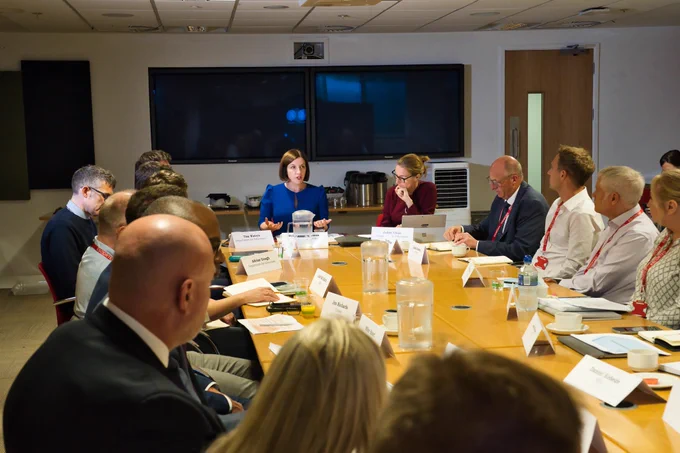 Bridget Phillipson MP at the head of a table, speaking with Department for Education officials and trade union representatives.