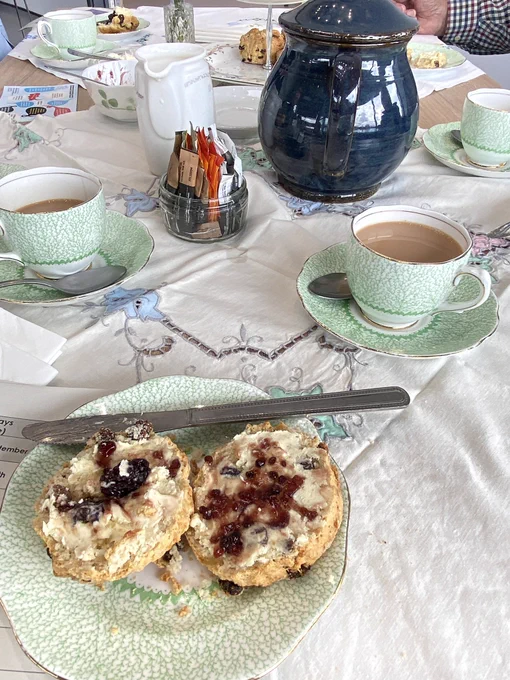 Scone with cream and jam and a cup of tea
